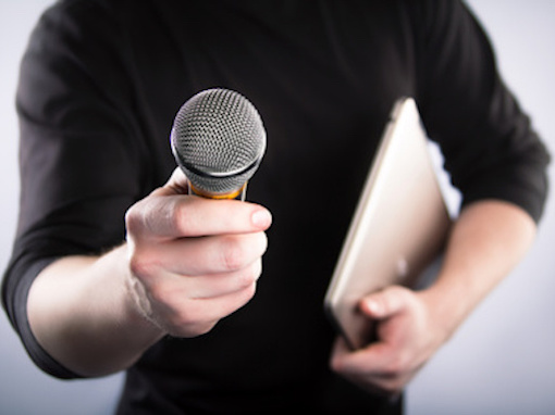 Male hand with microphone
